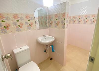 Clean and bright bathroom with floral tile design