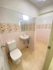 Clean and bright bathroom with floral tile design