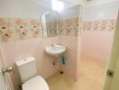 Clean and bright bathroom with floral tile design