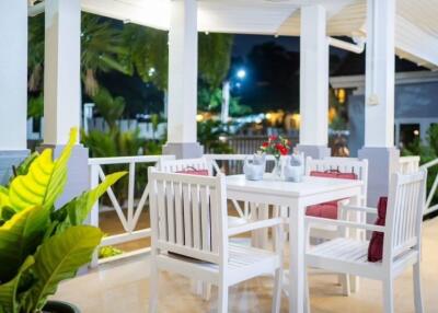 Cozy outdoor balcony with dining area