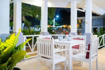 Cozy outdoor balcony with dining area