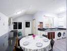 Spacious and well-lit kitchen with dining area