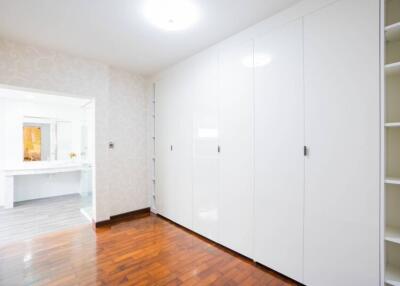 Spacious bedroom with large wardrobes and en-suite bathroom