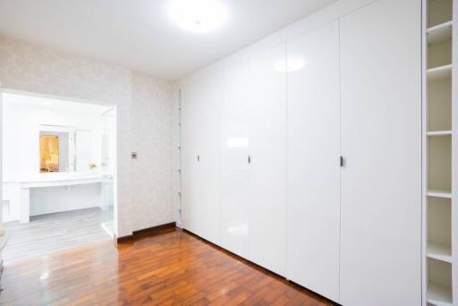 Spacious bedroom with large wardrobes and en-suite bathroom