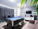 Modern recreation room with pool table and entertainment center