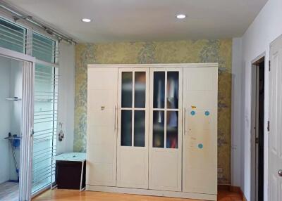 Spacious bedroom with wardrobe and natural light