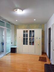 Spacious bedroom with wardrobe and natural light