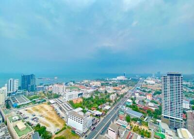 Aerial view of city with buildings and roads on a cloudy day