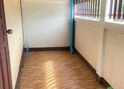 Covered hallway with tiled flooring