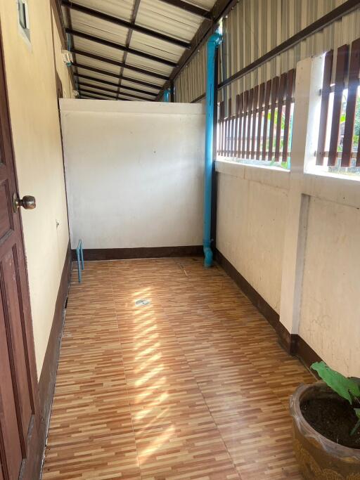 Covered hallway with tiled flooring