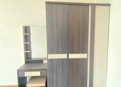 Bedroom with wardrobe and vanity desk