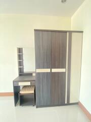 Bedroom with wardrobe and vanity desk