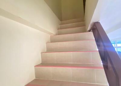 A staircase with tiles in a building