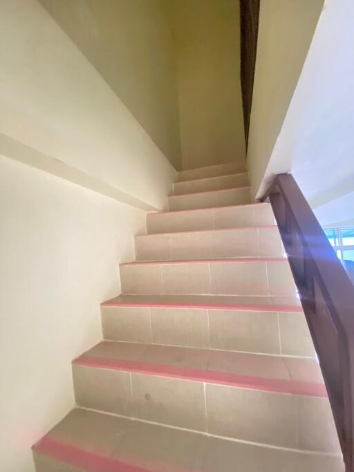 A staircase with tiles in a building