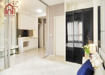 Modern bedroom with adjacent kitchenette