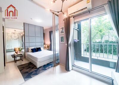 Bright and modern bedroom with large windows and balcony access