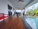 Covered patio with wooden floor and pool