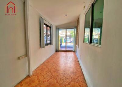 Indoor hallway or sunroom with tiled floor