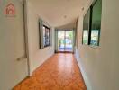 Indoor hallway or sunroom with tiled floor