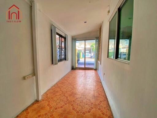 Indoor hallway or sunroom with tiled floor