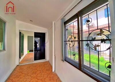 Bright hallway with decorative window grills