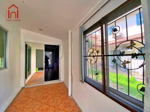 Bright hallway with decorative window grills