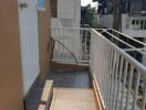 Outdoor balcony area with door and railing