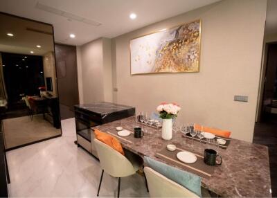 Modern dining area with a decorative table and chairs