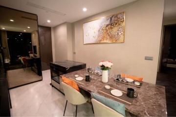 Modern dining area with a decorative table and chairs