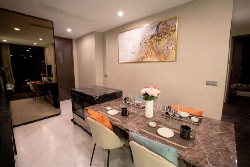 Modern dining area with a decorative table and chairs