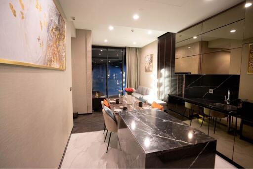 Modern dining area connected to a well-lit living space