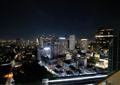 Night view of city skyline from balcony