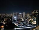 Night view of city skyline from balcony