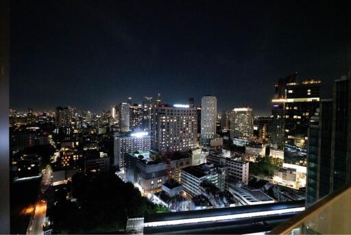 Night view of city skyline from balcony