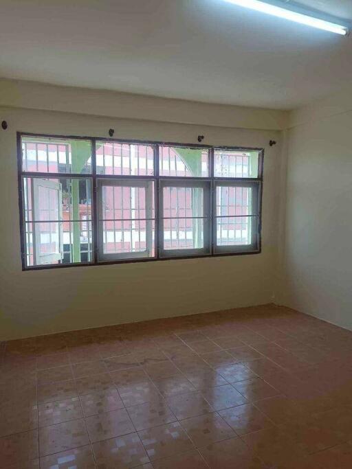 Spacious bedroom with large windows