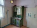 Small kitchen area with a sink and storage cabinet