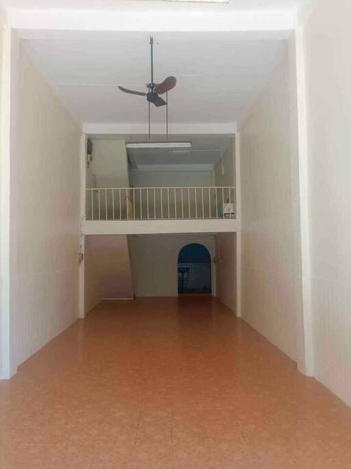 Spacious main living area with high ceiling and mezzanine