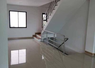 Modern interior with stairway and large windows