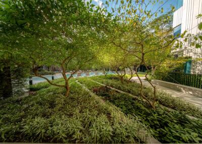 Beautiful garden area with greenery and pool view