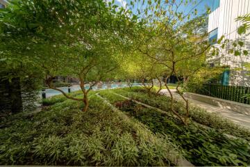 Beautiful garden area with greenery and pool view