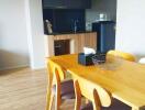 Modern dining area with table and kitchen view