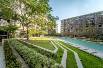 Lush green garden area with pool