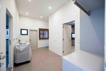 Laundry room with ample space and modern fixtures