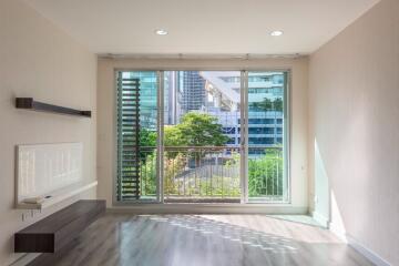 Bright living room with large window and city view