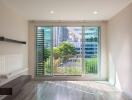 Bright living room with large window and city view