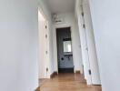 Bright and clean hallway with wooden floors