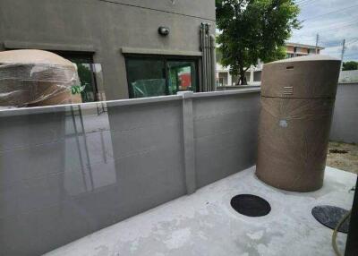 Outdoor utility space with water tanks