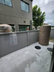 Outdoor utility space with water tanks