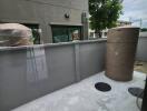 Outdoor utility space with water tanks