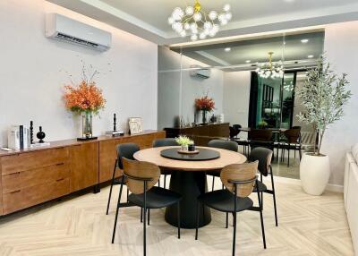 Modern dining room with round table and decorative elements